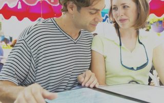 Store marketing during holiday events shows young couple looking at a menu. There's a colorful, festive-looking background.